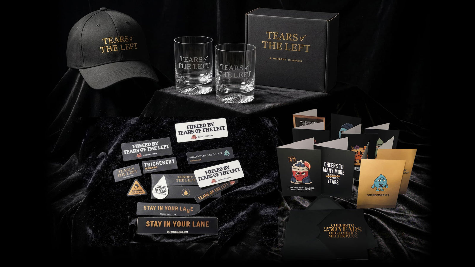 Tears of the Left merch collection laid out on black velvet. 